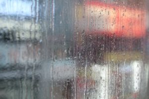 A close up of a rain covered window for Unity Counseling. Contact a depression therapist in Kent County, MI to learn more about depression treatment in Grand Rapids, MI. We can offer support from home with online depression therapy in Kent County, MI and other services. 