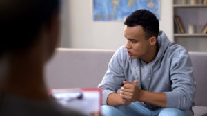 Shows a nervous teen attending therapy for the first time. Symbolizes how a teenage therapist is there to support you through the whole therapy process and help you navigate your depression symptoms.
