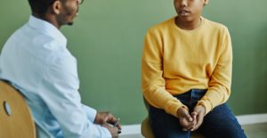 Shows a teen in teen counseling. Represents how a teenage therapist in grand rapids, mi will work with you on managing and coping with any mental health struggles.