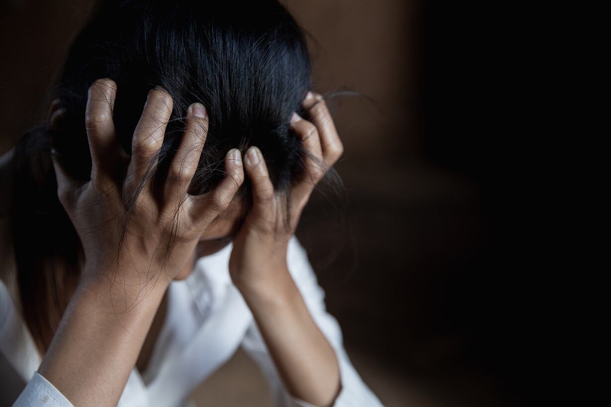 Woman covering face upset representing her feeling anxiety. If you can relate to how she feels, therapists in grand rapids, michigan can help! Address the anxiety in online therapy in Michigan today!